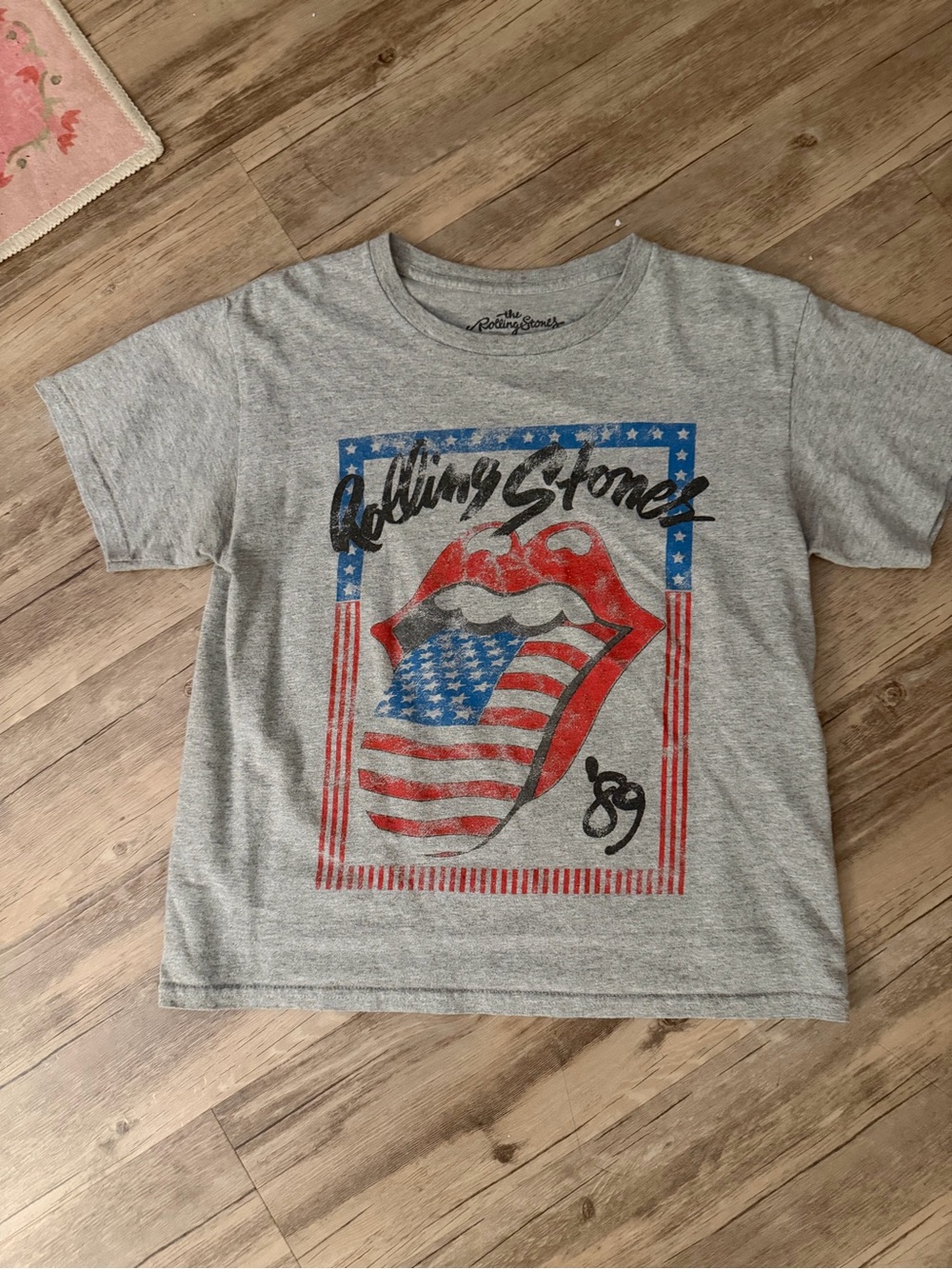 the Rolling Stones women’s Gray Graphic Tee with American Flag Tongue